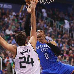 Utah Jazz center Jeff Withey (24) defends a shot attempt by Oklahoma City Thunder guard Russell Westbrook (0) as the Jazz and the Thunder play at Vivint Smart Home arena in Salt Lake City on Wednesday, Dec. 14, 2016.