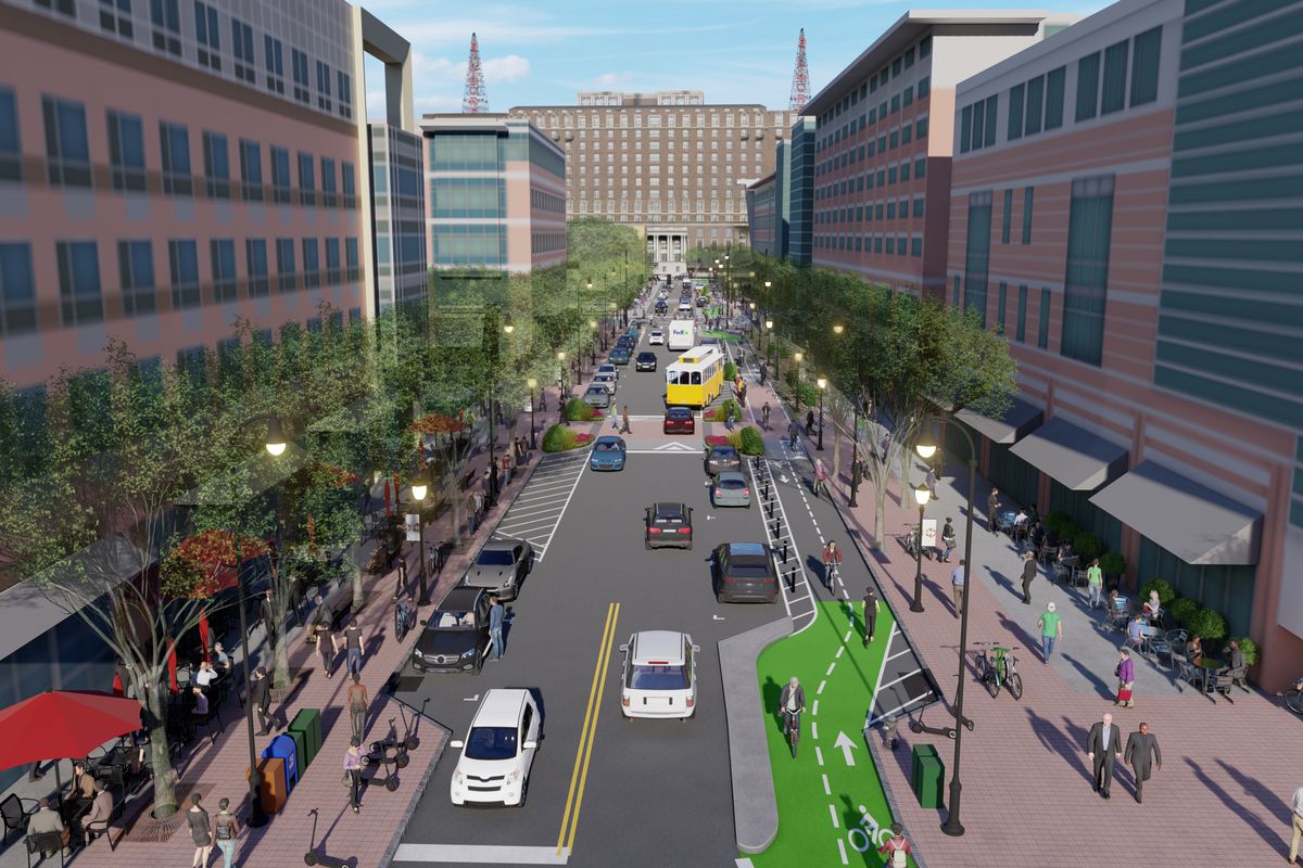 A rendering shows a street with one car lane in each direction, flanked by a protected two-way bike path and wide sidewalks.
