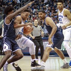 Brigham Young Cougars guard Jahshire Hardnett (0) drives the lane from the foul line against Loyola Marymount Lions guard Cameron Allen (3) as the Brigham Young Cougars take on the Loyola Marymount Lions at the Marriott Center in Provo on Thursday, Jan. 18, 2018.