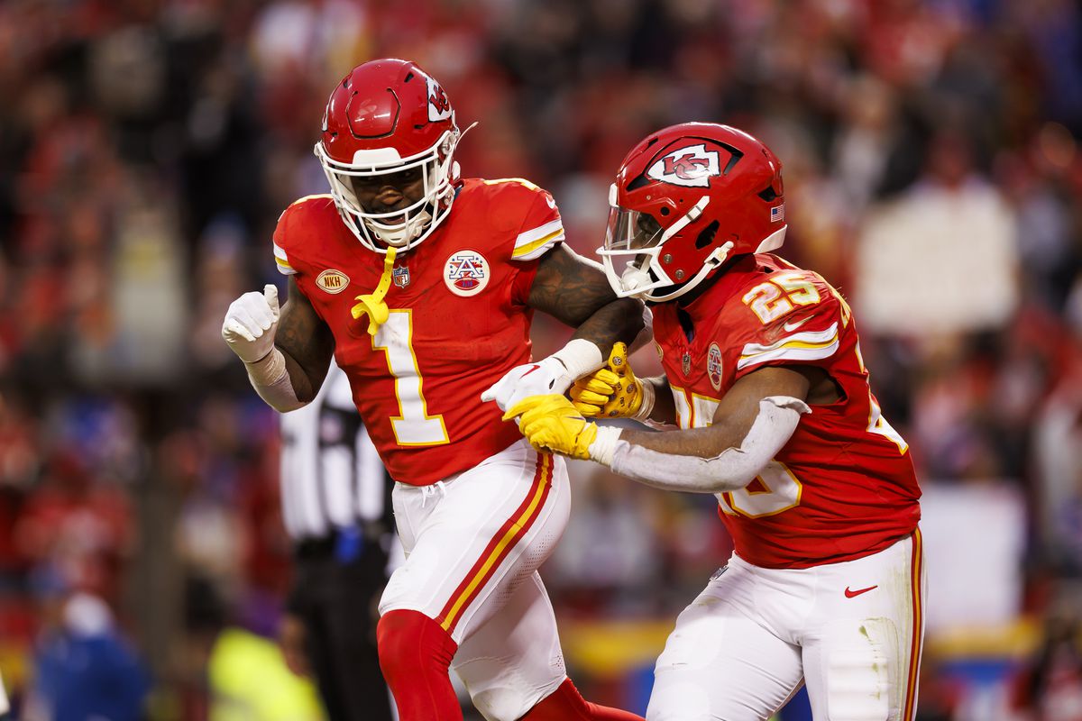 Jerick McKinnon #1 of the Kansas City Chiefs celebrates with Clyde Edwards-Helaire #25 of the Kansas City Chiefs after scoring a touchdown during an NFL football game against the Buffalo Bills at GEHA Field at Arrowhead Stadium on December 10, 2023 in Kansas City, Missouri.