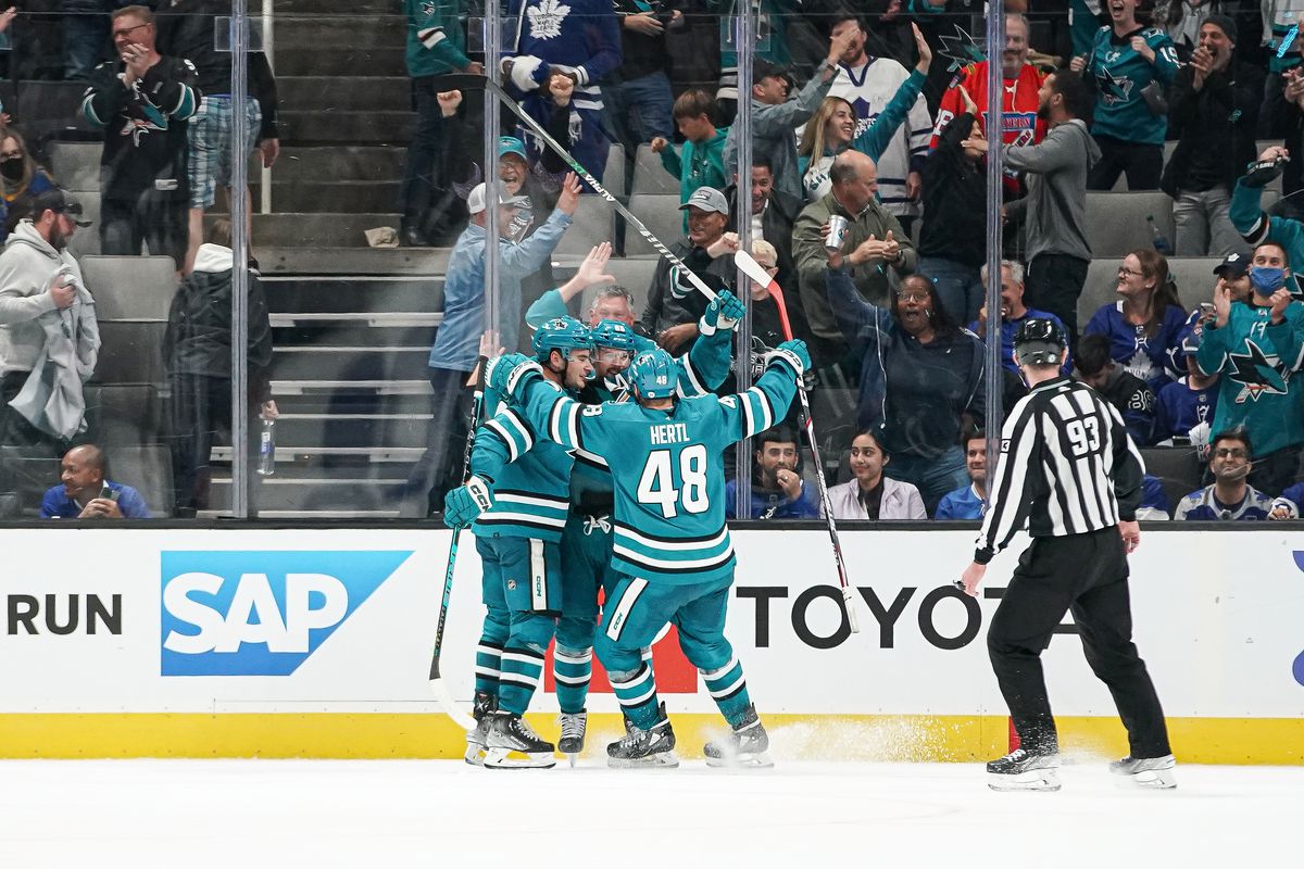 Erik Karlsson, Timo Meier and Tomas Hertl of the San Jose Sharks celebrate the overtime game-winning goal against the Toronto Maple Leafs at SAP Center on October 27, 2022 in San Jose, California.