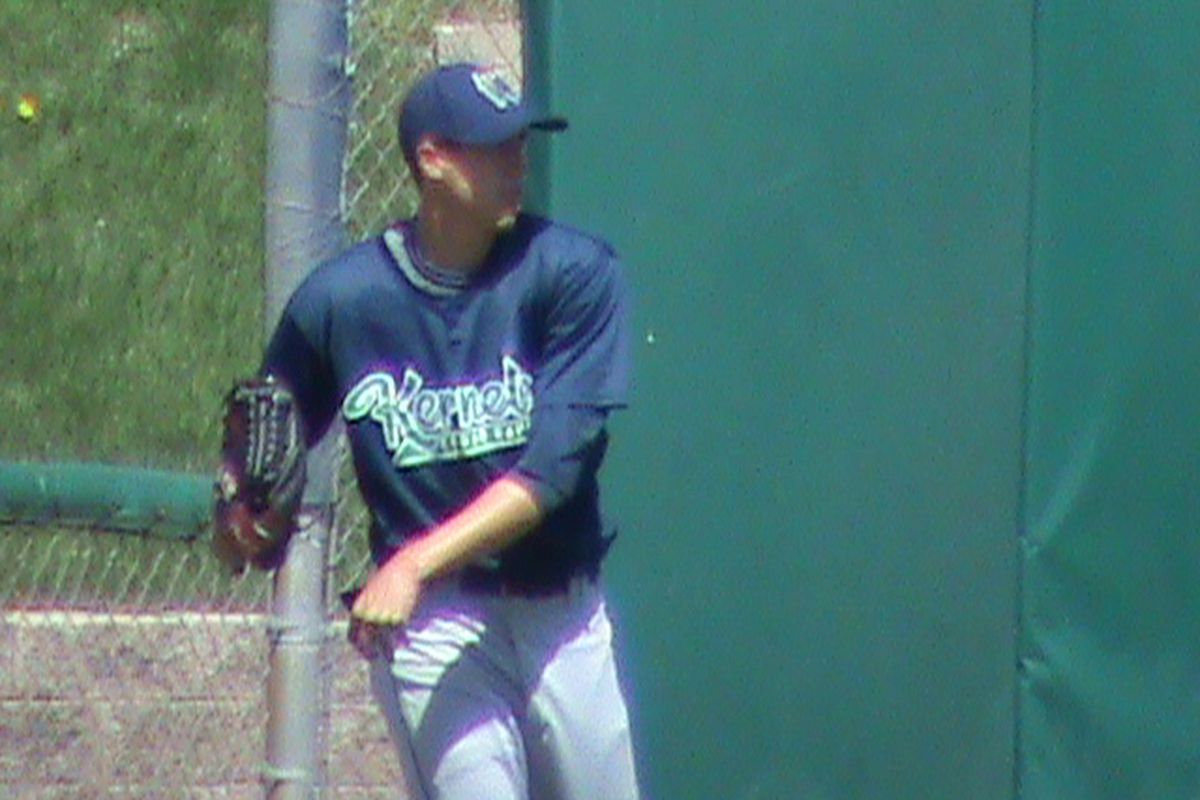 Tyler Skaggs throws long toss, staying loose for the Kernels' unconventional six man rotation. 