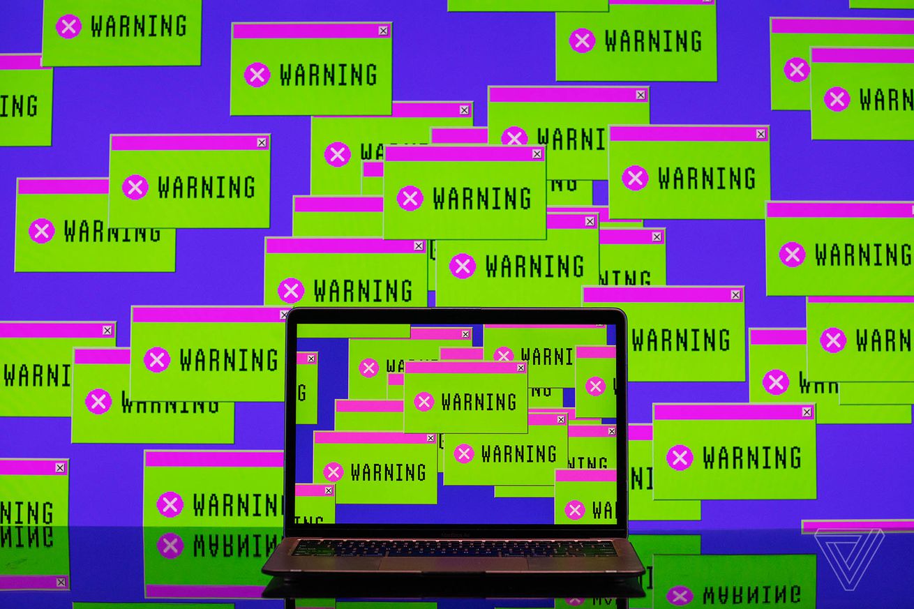 A laptop surrounded by green and pink message boxes that say “warning.”