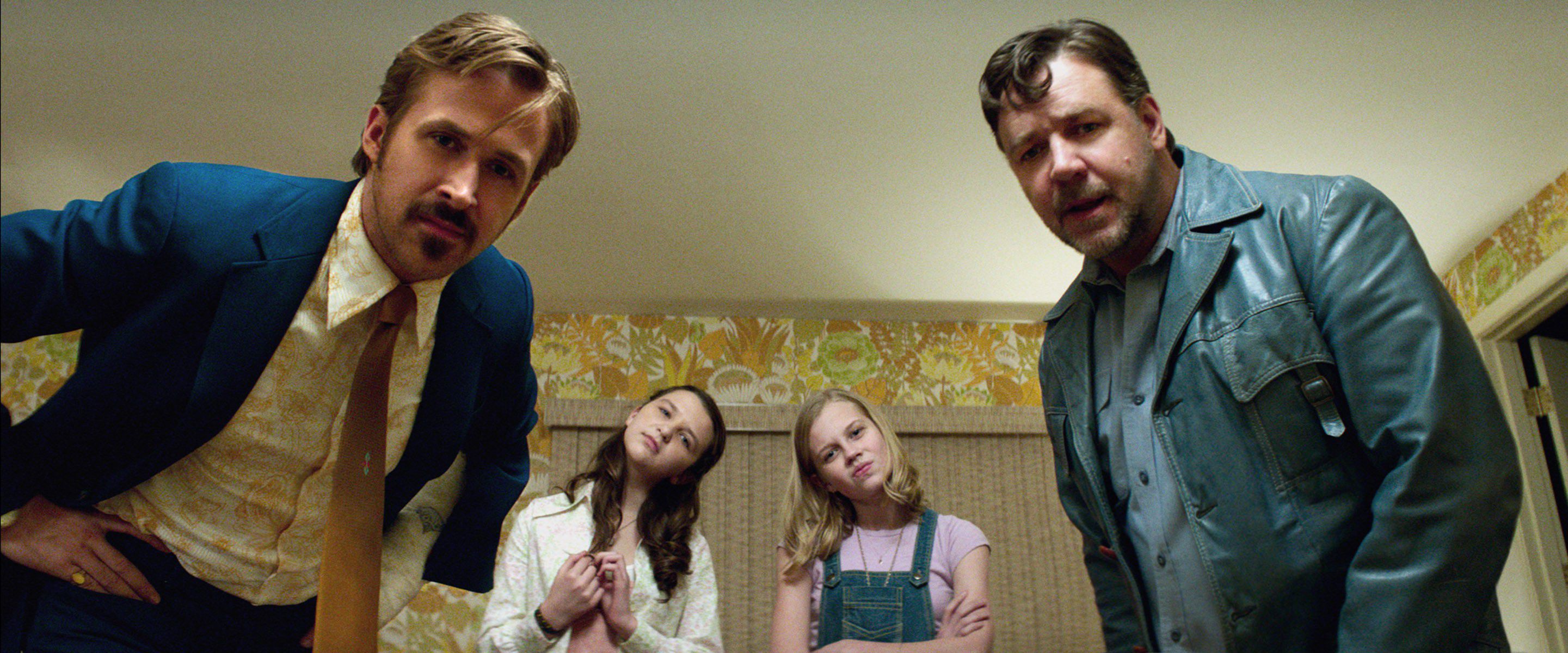 Ryan Goslling and Russell Crowe peer into the camera in The Nice Guys