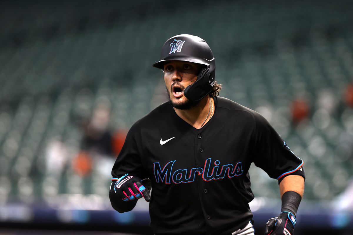 Miguel Rojas #19 of the Miami Marlins reacts after hitting a home run in the second inning of Game 1 of the NLDS between the Atlanta Braves and the Miami Marlins at Minute Maid Park on Tuesday, October 6, 2020 in Houston, Texas.