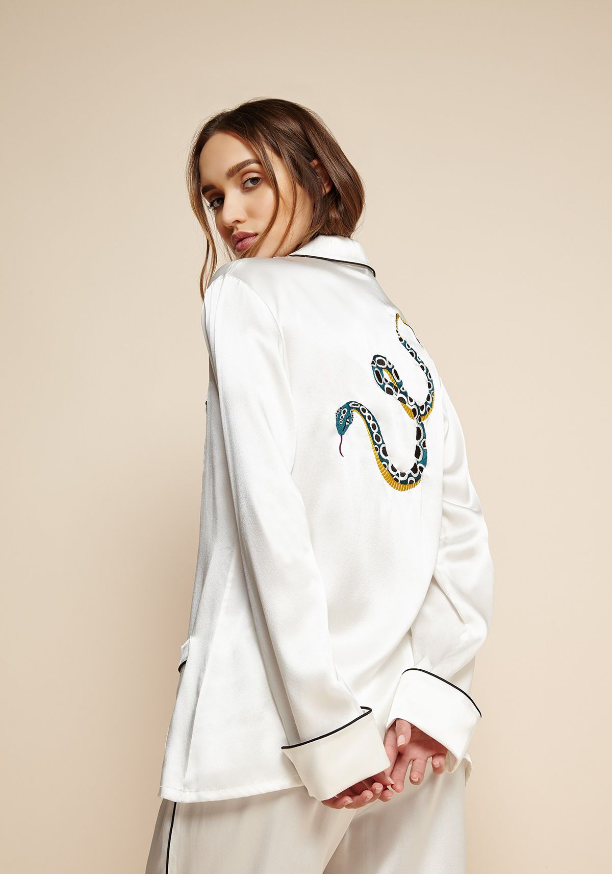 White silk pajamas with a snake embroidered on the back
