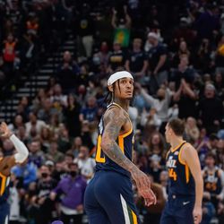 Utah Jazz guard Jordan Clarkson, checks on the television screen for his dunk during an NBA game at Vivint Arena in Salt Lake City on Thursday, Dec. 23, 2021.