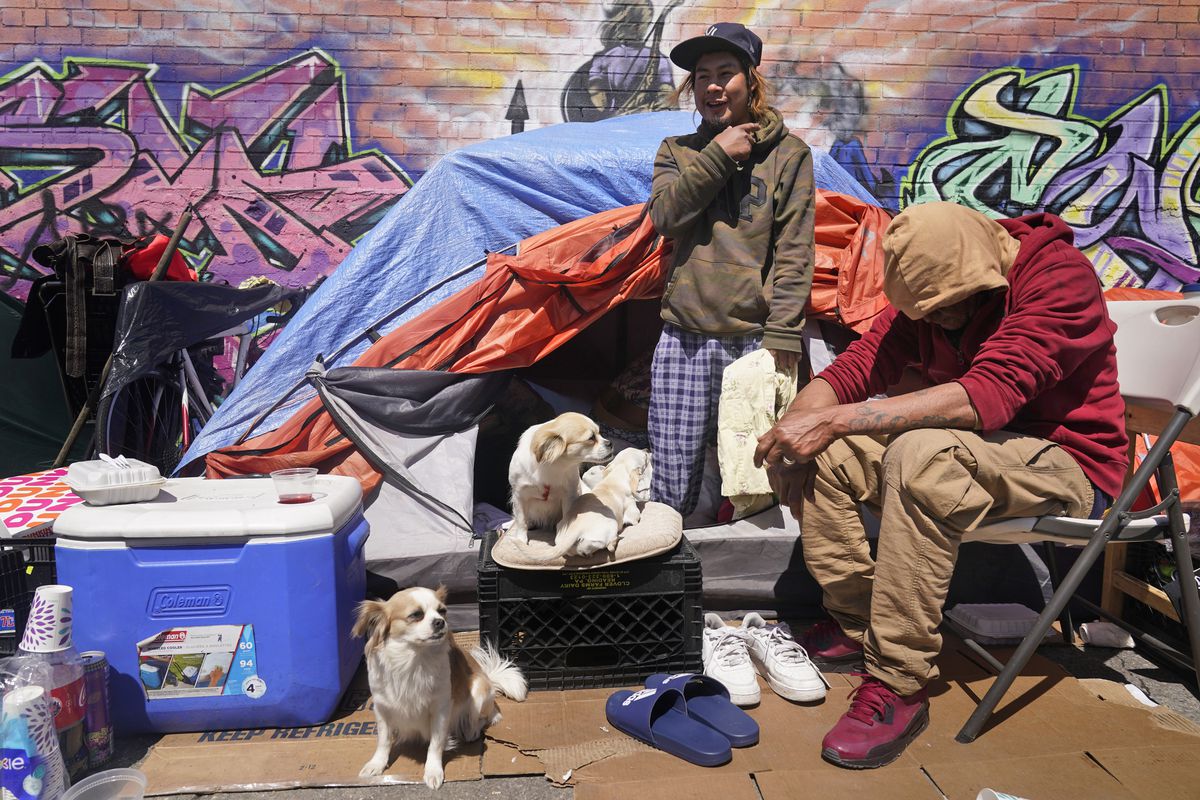 Lucio Lopez (left) talks with friends at a homeless encampment in Queens. Unemployment among Hispanic immigrants has doubled in the United States, going from 4.8% in January 2020 to 8.8% in February 2021, according to the Migration Policy Institute.