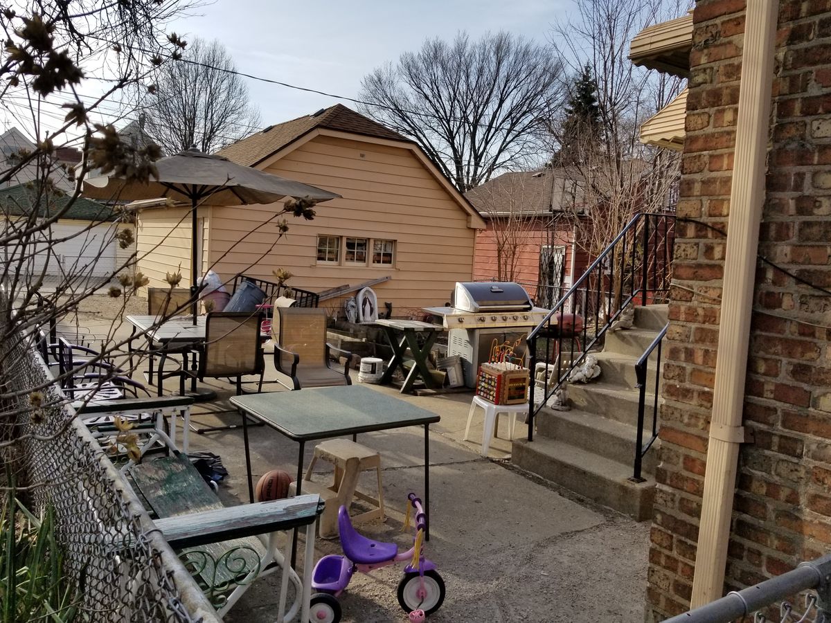 Federal authorities say they found 19 adults and 14 children in a Cicero home during an early morning raid Tuesday, following allegations that Guatemalan citizens were being held in the basement there and forced to work. | Manny Ramos / Sun-Times