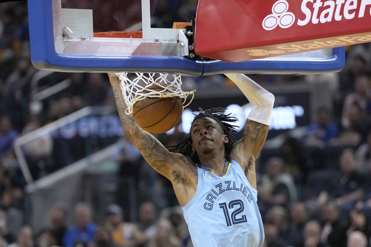 &nbsp;Ja Morant #12 of the Memphis Grizzlies slam dunks against the Golden State Warriors in the second half of Game Three of the Western Conference Semifinals of the NBA Playoffs at Chase Center on May 07, 2022 in San Francisco, California.