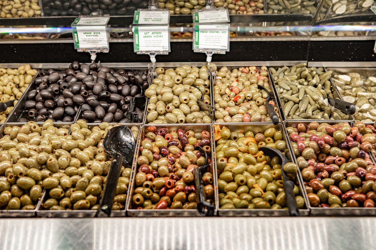 An olive bar at a supermarket.