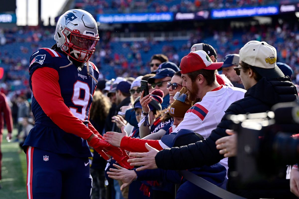 Matthew Judon #9 of the New England Patriots greets fans before a game against the Miami Dolphins at Gillette Stadium on January 01, 2023 in Foxborough, Massachusetts.