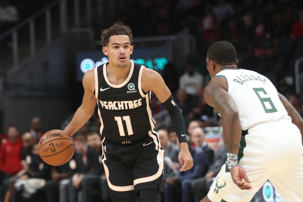 Atlanta Hawks guard Trae Young drives against Milwaukee Bucks guard Eric Bledsoe in the first quarter at State Farm Arena.&nbsp;
