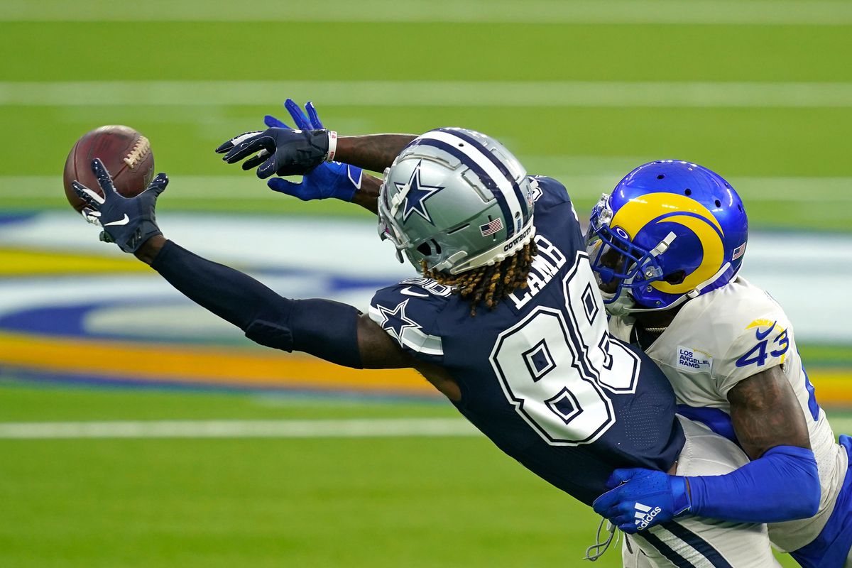 Dallas Cowboys receiver CeeDee Lamb (88) is unable to make a catch as Los Angeles Rams safety John Johnson III (43) defense the play during the first half at SoFi Stadium.