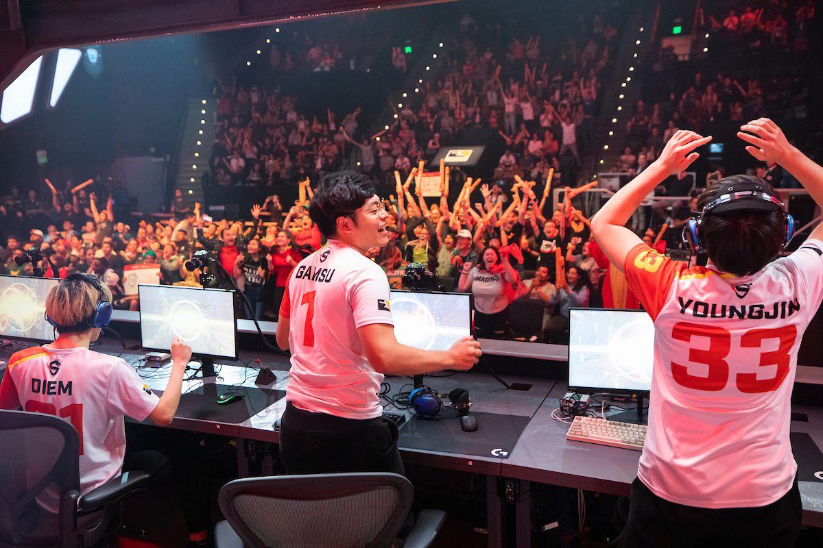 Overwatch League - the Shanghai Dragons cheer after a win on stage.