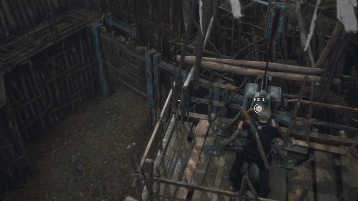 Resident Evil 4&nbsp;remake&nbsp;Leon opening the gate to the Valley area