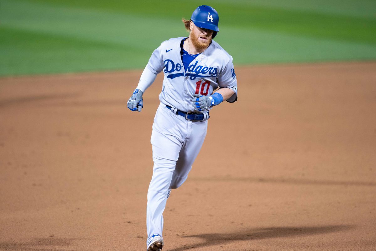 Los Angeles Dodgers third baseman Justin Turner (10) rounds third base after hitting a solo home run against the Oakland Athletics during the eighth inning at RingCentral Coliseum.