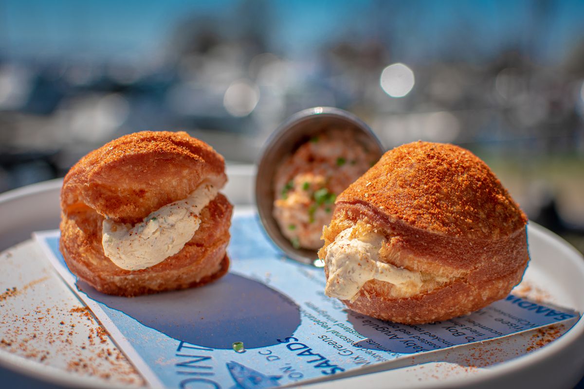 The point’s savory doughnuts are stuffed with crab dip and coated in Old Bay
