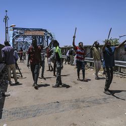 Protesters walk towards the sit-in protest outside the Sudanese military headquarters, in Khartoum, Sudan, Tuesday, May 14, 2019. Sudanese protesters say security agents loyal to ousted President Omar al-Bashir attacked their sit-ins overnight, setting off clashes that left six people dead, including an army officer, and heightened tensions as the opposition holds talks with the ruling military council. Both the protesters and the transitional military council say the violence was instigated by al-Bashir loyalists from within the security forces.