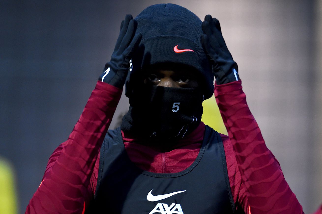 Ibrahima Konate of Liverpool in a hat and mask during a training at AXA Training Centre on November 18, 2021 in Kirkby, England.