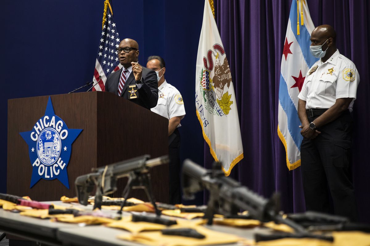 Chicago Police Supt. David Brown gestures toward a table of guns allegedly confiscated by Chicago police officers during a press conference at CPD headquarters on June 29, 2020.