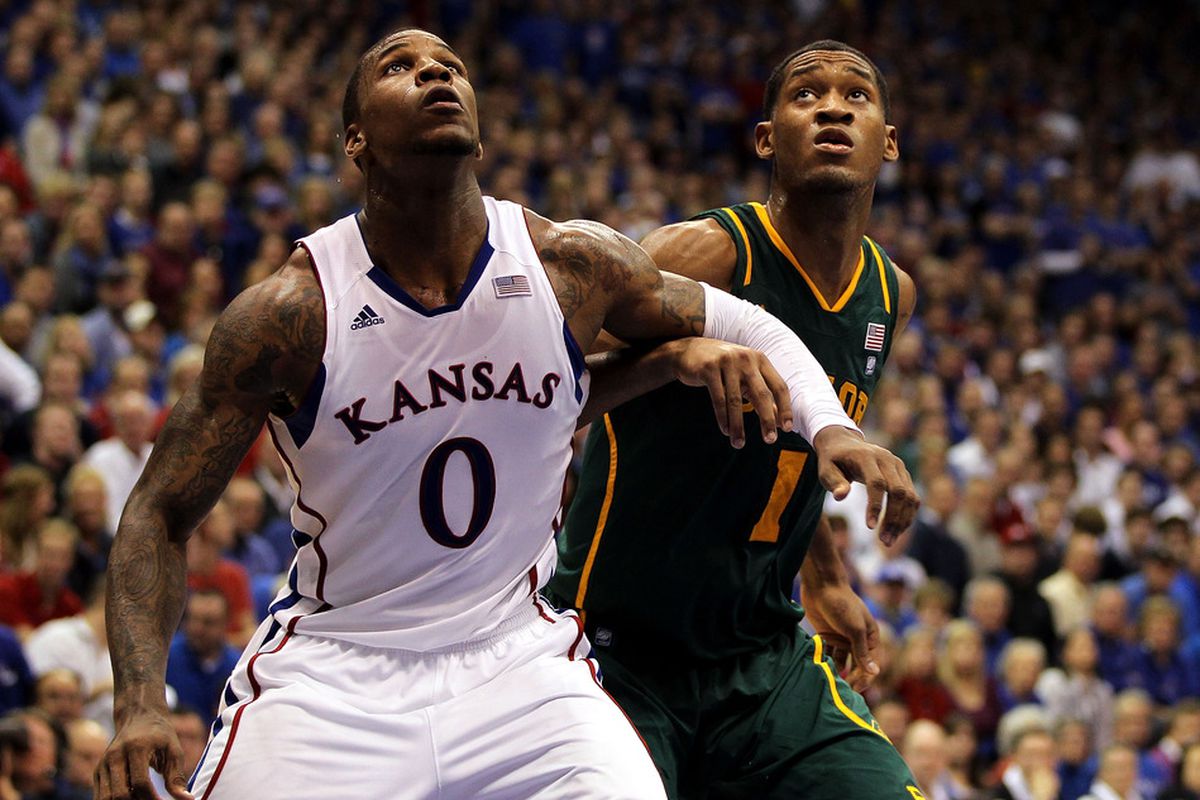 LAWRENCE, KS - JANUARY 16:  Thomas Robinson #0 of the Kansas Jayhawks and Perry Jones III #1 of the Baylor Bears box out during the game on January 16, 2012 at Allen Fieldhouse in Lawrence, Kansas.  (Photo by Jamie Squire/Getty Images)