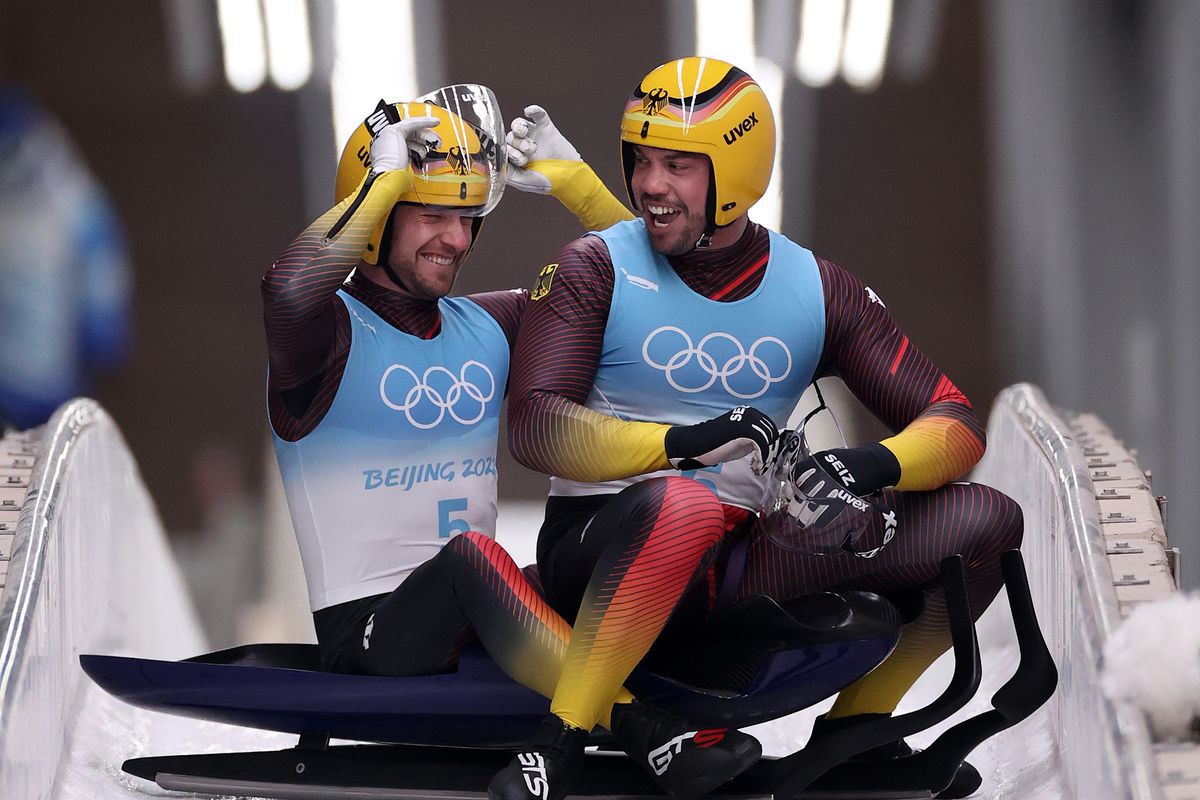 Tobias Wendl and Tobias Arlt of Team Germany react after winning gold during the Luge Doubles Run 2 on day five of the Beijing 2022 Winter Olympic Games at National Sliding Centre on February 09, 2022 in Yanqing, China.