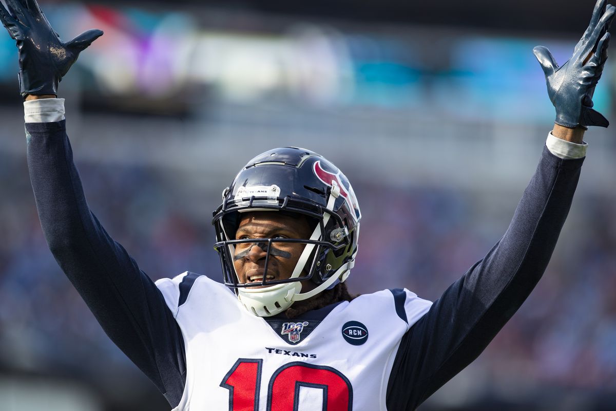 DeAndre Hopkins #10 of the Houston Texans celebrates a touchdown reception by teammate Kenny Stills #12 (not pictured) during the second quarter against the Tennessee Titans at Nissan Stadium on December 15, 2019 in Nashville, Tennessee.