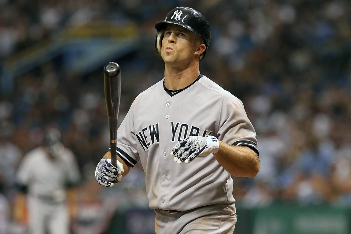 April 6, 2012; St. Petersburg, FL, USA; New York Yankees left fielder Brett Gardner (11) reacts after at bat against the Tampa Bay Rays at Tropicana Field. Tampa Bay Rays defeated the New York Yankees 7-6. Mandatory Credit: Kim Klement-US PRESSWIRE
