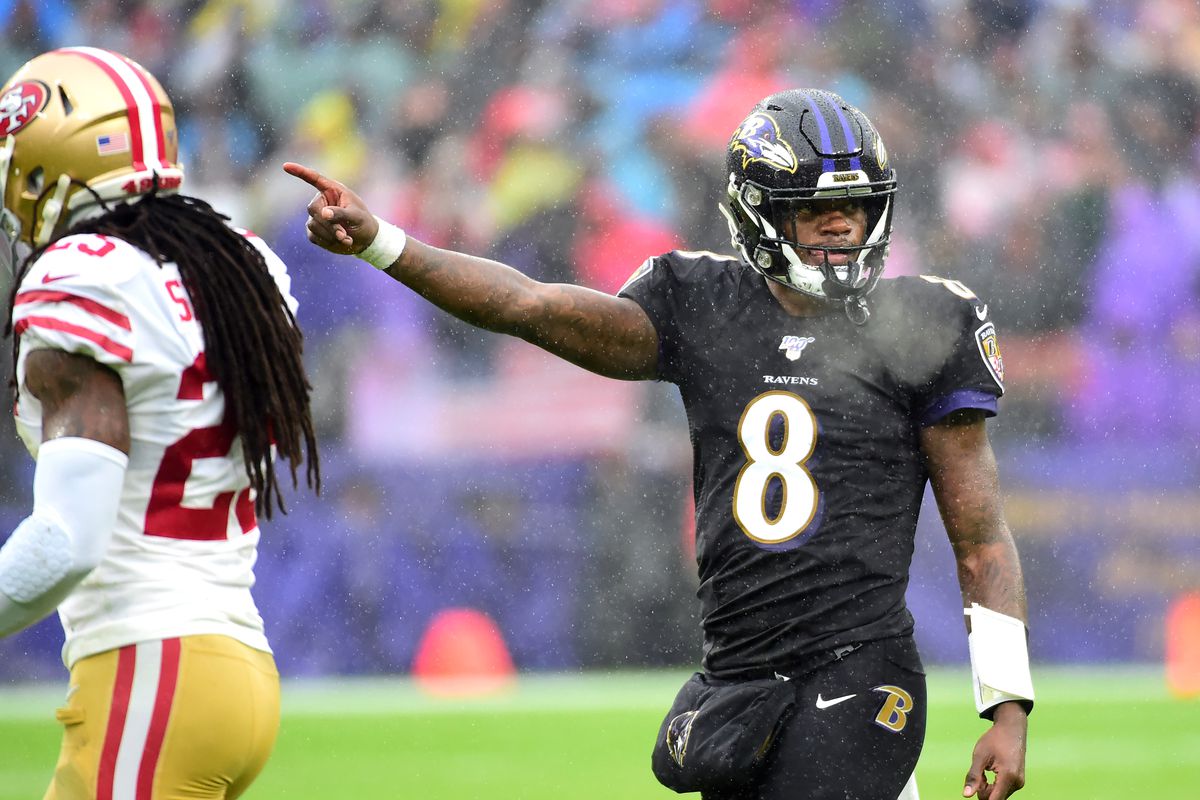 Baltimore Ravens quarterback Lamar Jackson indicates a first down in the second quarter against the San Francisco 49ers at M&amp;T Bank Stadium.