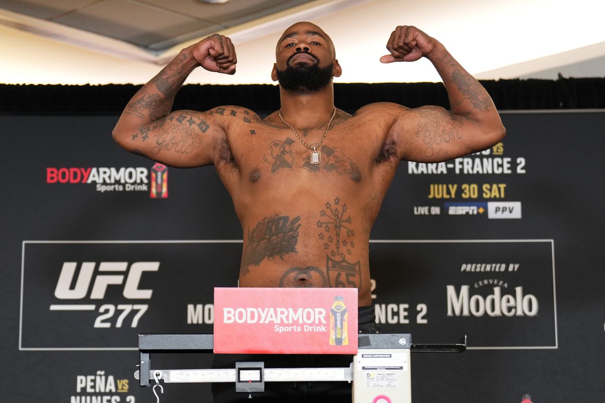 Don’Tale Mayes poses on the scale during the UFC 277 official weigh-in at the Hyatt Regency hotel&nbsp;