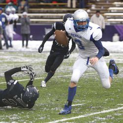 Rich quarterback McKay Jarman attempts a 2-point conversion as Duchesne High School defeats Rich High School 14-13 to win the 1A State football championship game  Saturday, Nov. 16, 2013, in Ogden.  