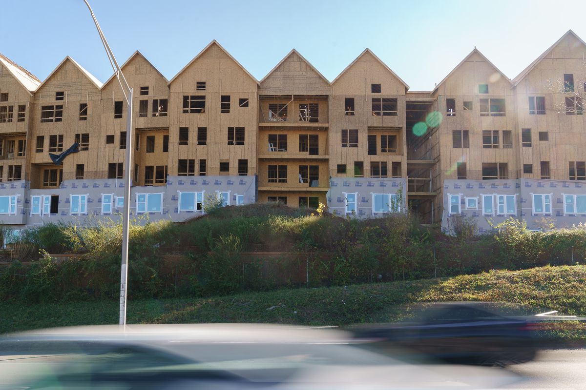 Row of multifamily houses under construction