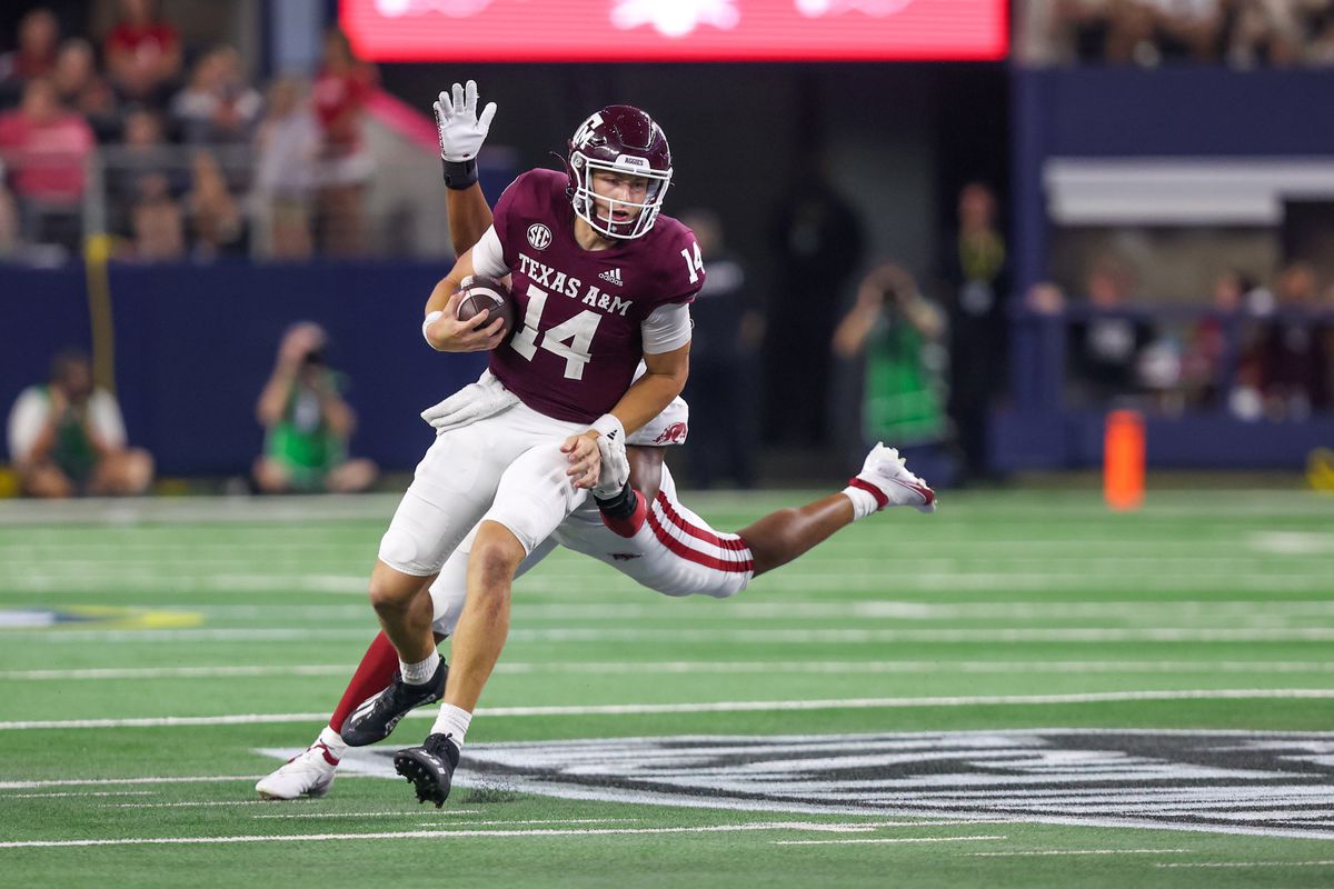 Texas A&amp;M Aggies quarterback Max Johnson (14) scrambles during the Southwest Classic game between Arkansas and Texas A&amp;M on September 24, 2022 at AT&amp;T Stadium in Arlington, TX.