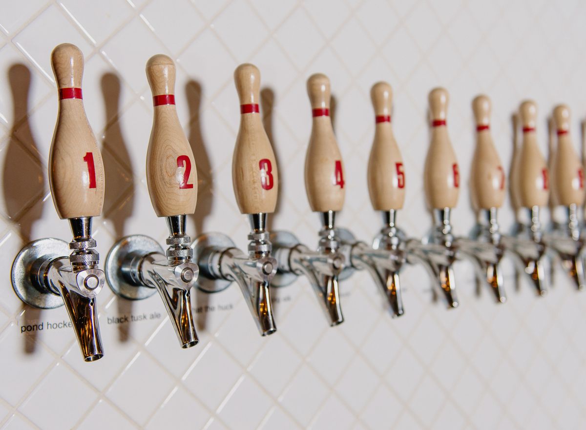 Beer taps shaped like bowling pins.