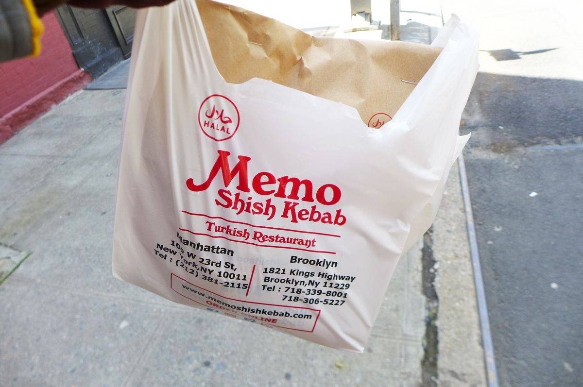 A white plastic bag with the name of the restaurant in red.