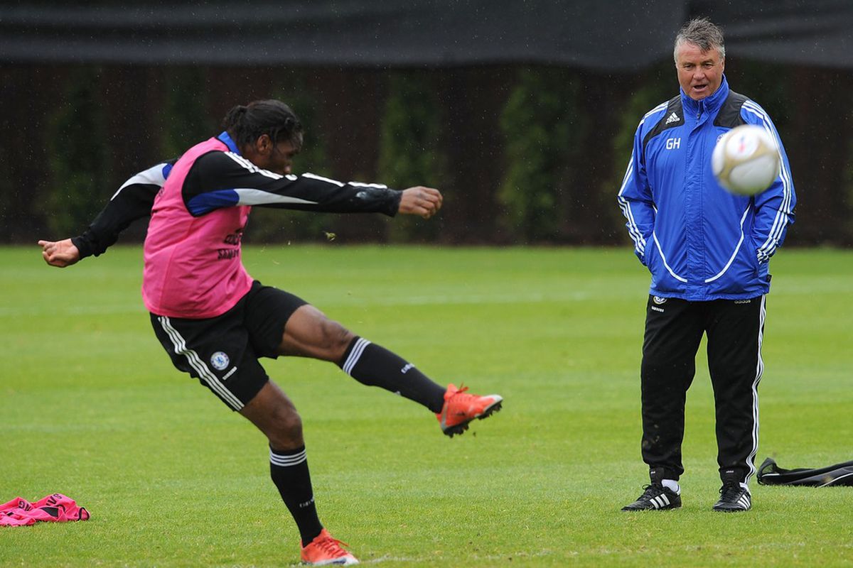 COBHAM, ENGLAND - MAY 27: Guus Hiddink watches as Didier Drogba shoots during the Chelsea Football Club Training Session held at their Cobham Training Ground on May 27, 2009 in Cobham, England. (Photo by Christopher Lee/Getty Images) 