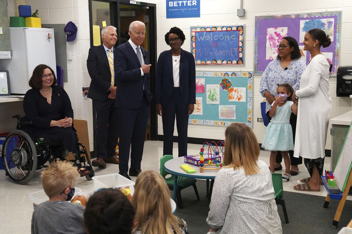 President Joe Biden, center, with U.S. Rep. Lauren Underwood (IL-14), right, and Sen. Tammy Duckworth, left, as they tour the Children’s Learning Center at McHenry County College in Crystal Lake in July,