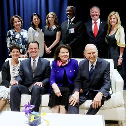 From left, Sister Lynette Bowen, Elder Shayne M. Bowen, a General Authority Seventy, Sister Wendy Nelson and President Russell M. Nelson, pose for a photo with local leaders and VIPs at the Amway Center in Orlando, Florida, prior to a devotional on Sunday, June 9, 2019.