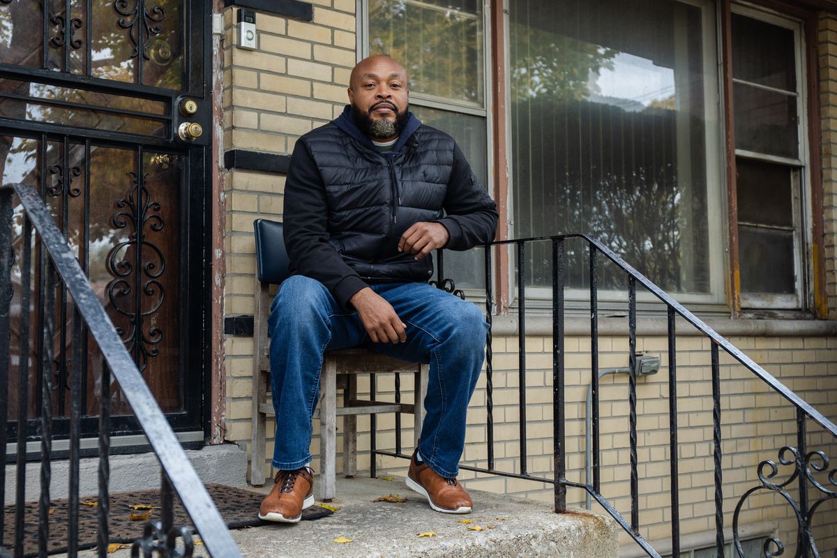 John Daniels, who drives trucks for a living, sits outside his childhood home where his mom still lives in the West Englewood community on the city’s South Side. Daniels moved to Matteson, Illinois, because he “wanted peace and quiet,” he said.