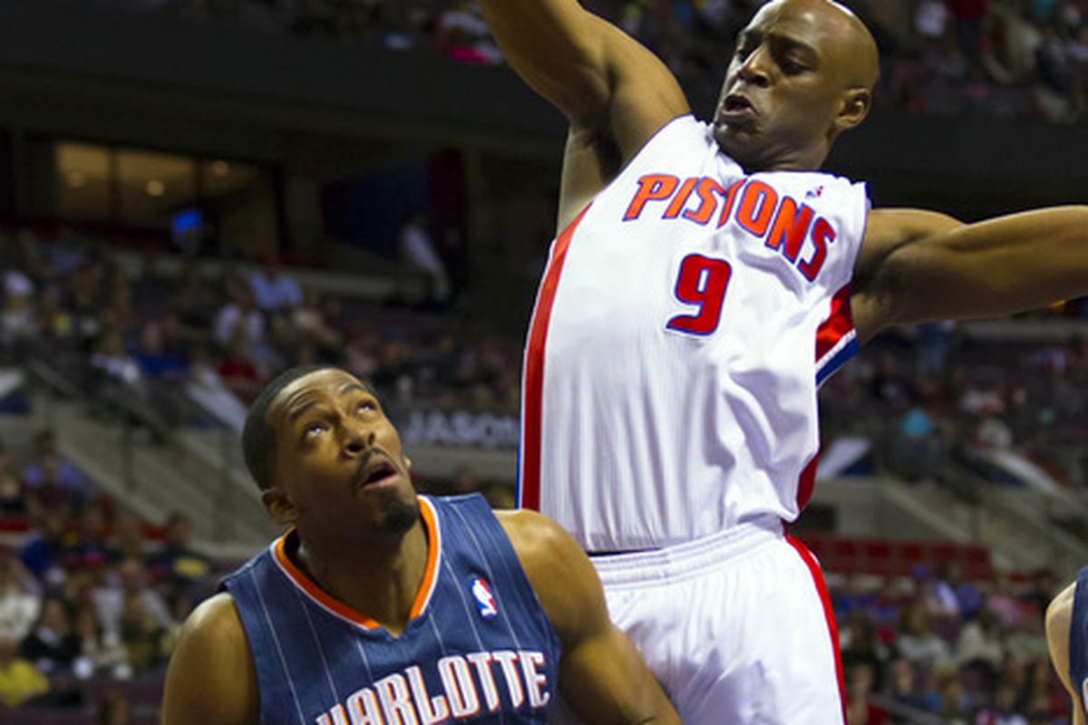March 31, 2012; Auburn Hills, MI, USA; Charlotte Bobcats forward Derrick Brown (4) is defended by Detroit Pistons small forward Damien Wilkins (9) in the second quarter at The Palace. Mandatory Credit: Rick Osentoski-US PRESSWIRE