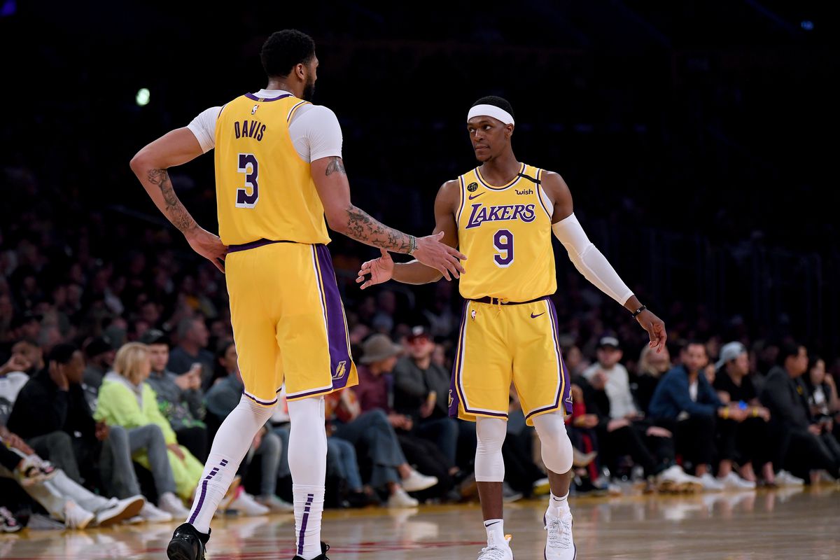 Anthony Davis and Rajon Rondo of the Los Angeles Lakers celebrate a Davis blocked shot against the Memphis Grizzlies at Staples Center on February 21, 2020 in Los Angeles, California.&nbsp;