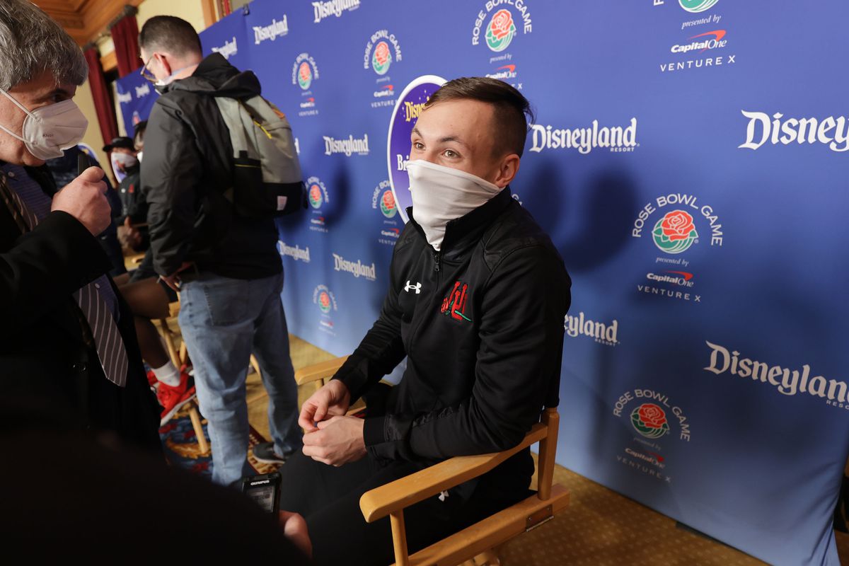 Utah Utes wide receiver Britain Covey, wearing a mask, speaks to a reporter during a press conference at Disneyland 