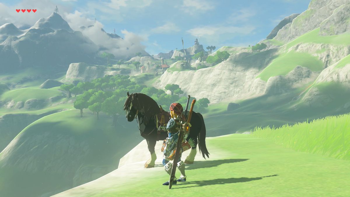Link and a black horse gaze off a hillside in Breath of the Wild