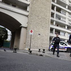 French police officers work near the scene where French soldiers were hit and injured by a vehicle in the western Paris suburb of Levallois-Perret near Paris, France, Wednesday, Aug. 9, 2017. French police are searching for a driver who slammed his BMW into a group of soldiers, injuring six of them in an apparent ambush before speeding away, officials said. The incident in Levallois, northwest of Paris, is the latest of several attacks targeting security forces in France.(AP Photo/Kamil Zihnioglu)