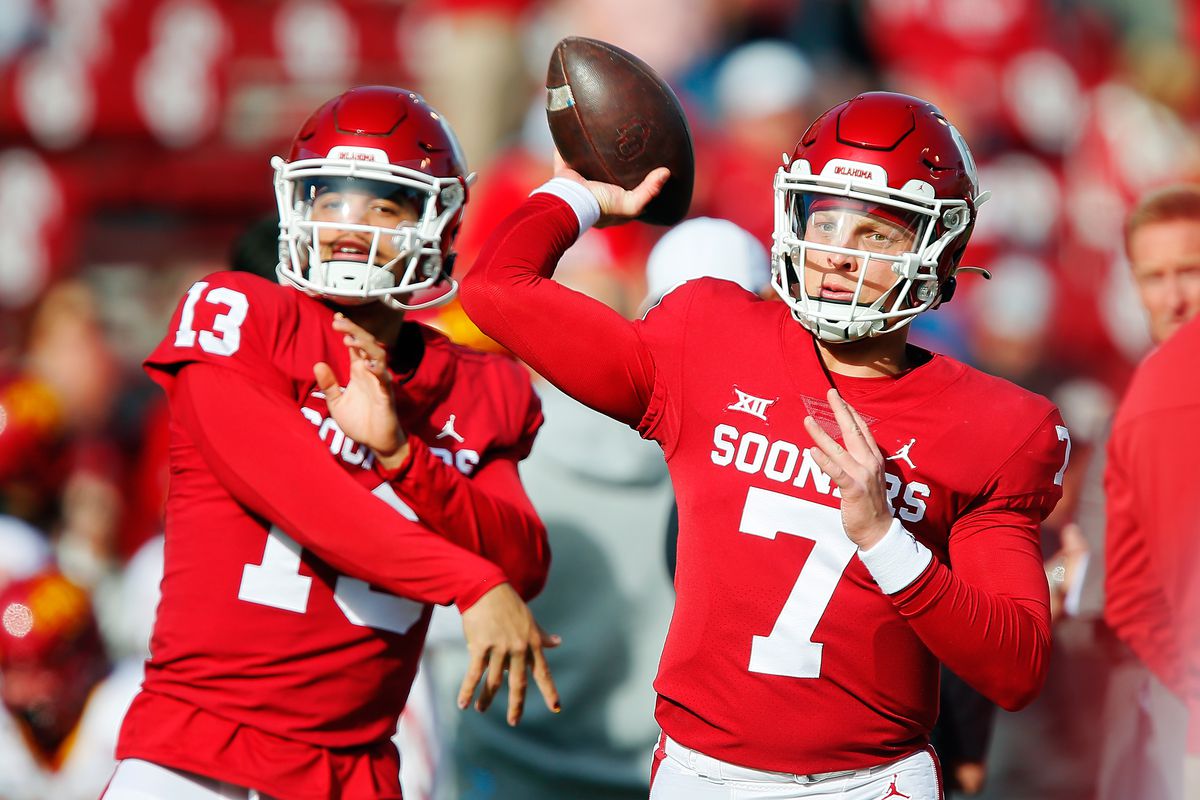 Quarterbacks Caleb Williams and Spencer Rattler of the Oklahoma Sooners throw passes before a game against the Iowa State Cyclones at Gaylord Family Oklahoma Memorial Stadium on November 20, 2021 in Norman, Oklahoma.