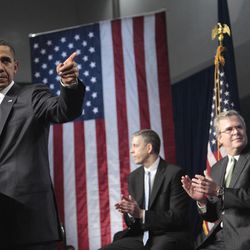 President Barack Obama,accompanied by former Florida Gov. Jeb Bush, right, and Education Secretary Arne Duncan, gestures while speaking at Miami Central Senior High School in Miami, Friday, March, 4, 2011. (AP Photo/Pablo Martinez Monsivais)