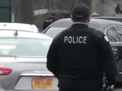 Chicago police officers provided security at Oak Wood Cemetery, where Lawrence “Big Law” Loggins was buried  Feb. 16. | From YouTube video by @Crimechaser