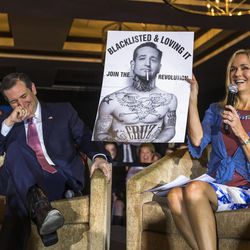 Republican presidential candidate Sen. Ted Cruz, R-Texas reacts to a poster displayed by moderator Rebecca Hagelin during a campaign stop, Wednesday, March 30, 2016, in Madison, Wis. 
