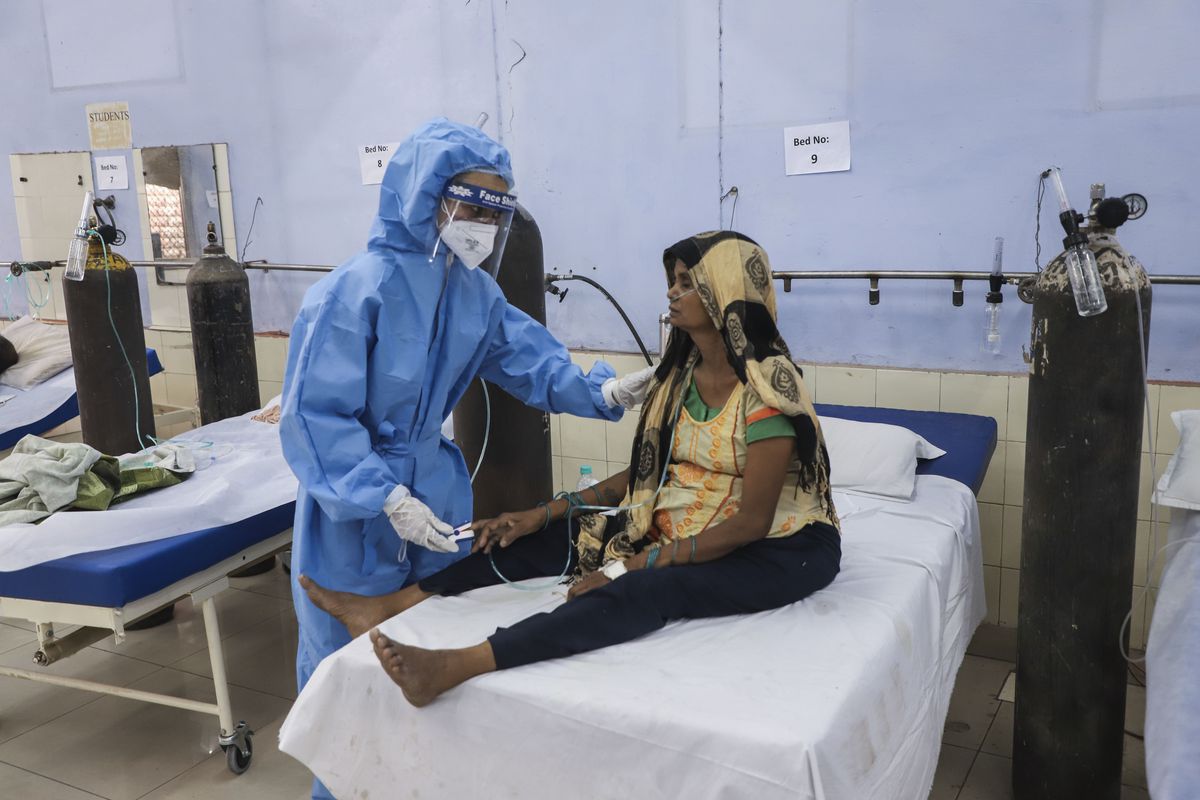 A nurse attends to a patient at a free COVID-19 care center being operated by a Sikh voluntary organization in Ghaziabad, outskirts ofNew Delhi, India, Monday, May 17, 2021. 